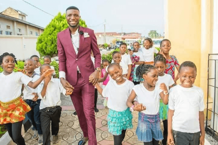 Mathew Eluwole with children at the concert